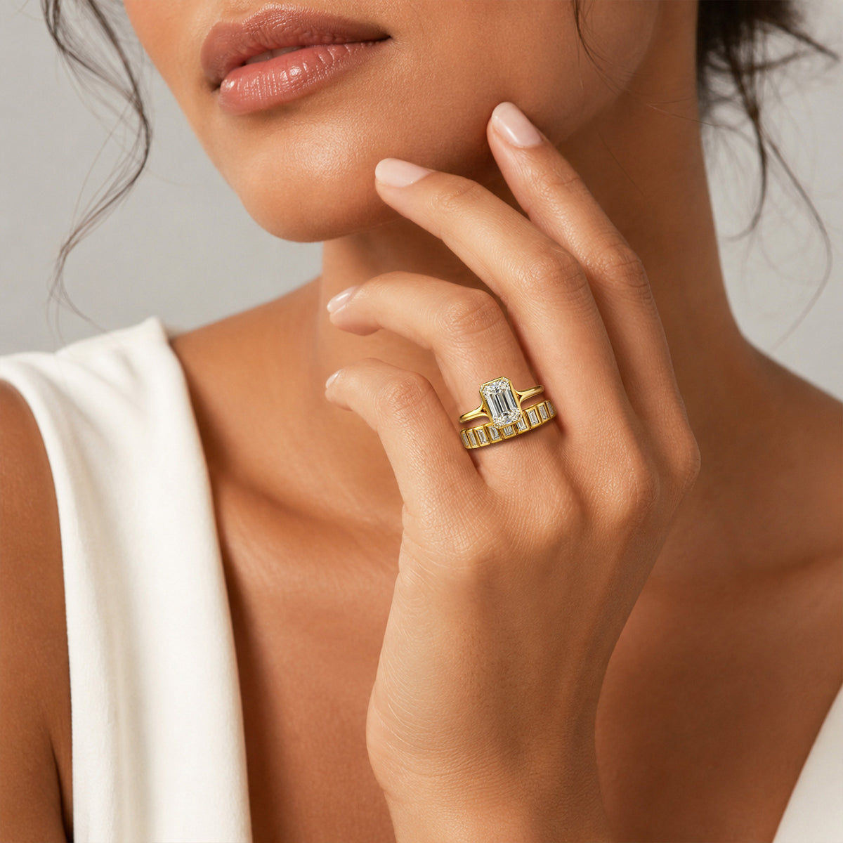 Emerald Cut Lab Grown Diamond Center Stone Cathedral Basket And Bezel Setting Bridal Set With Baguette Cut Band #MCBSL0017