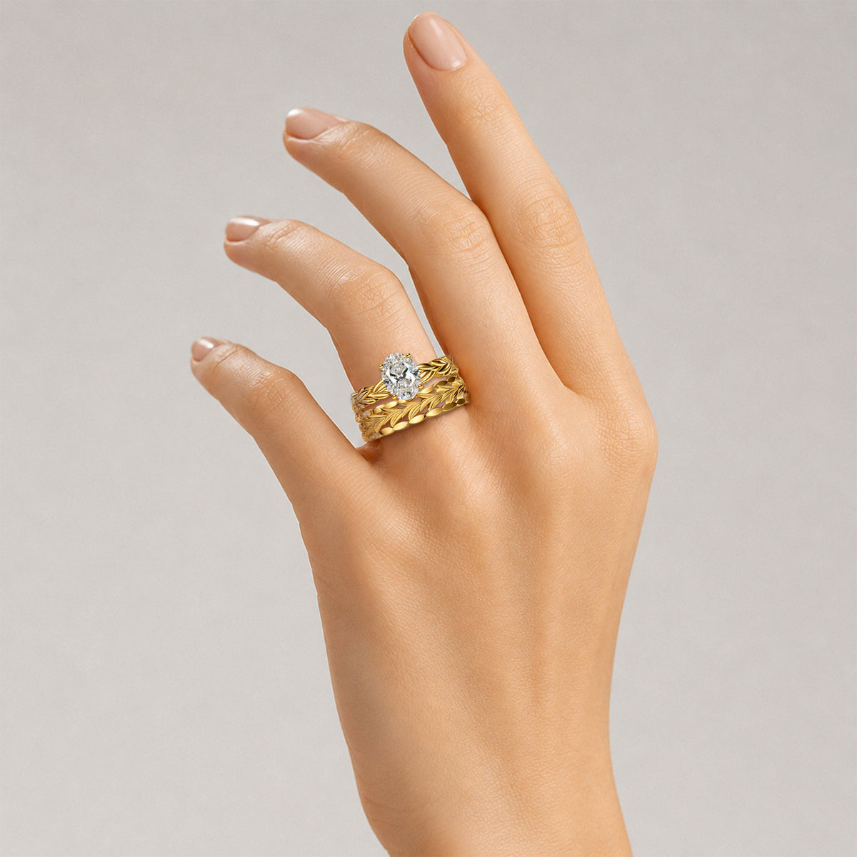Nature Inspired Oval Cut Lab Grown Diamond Center Stone Hand Brushed Finish Bridal Set With Leaf Design Band #MCBSL0037