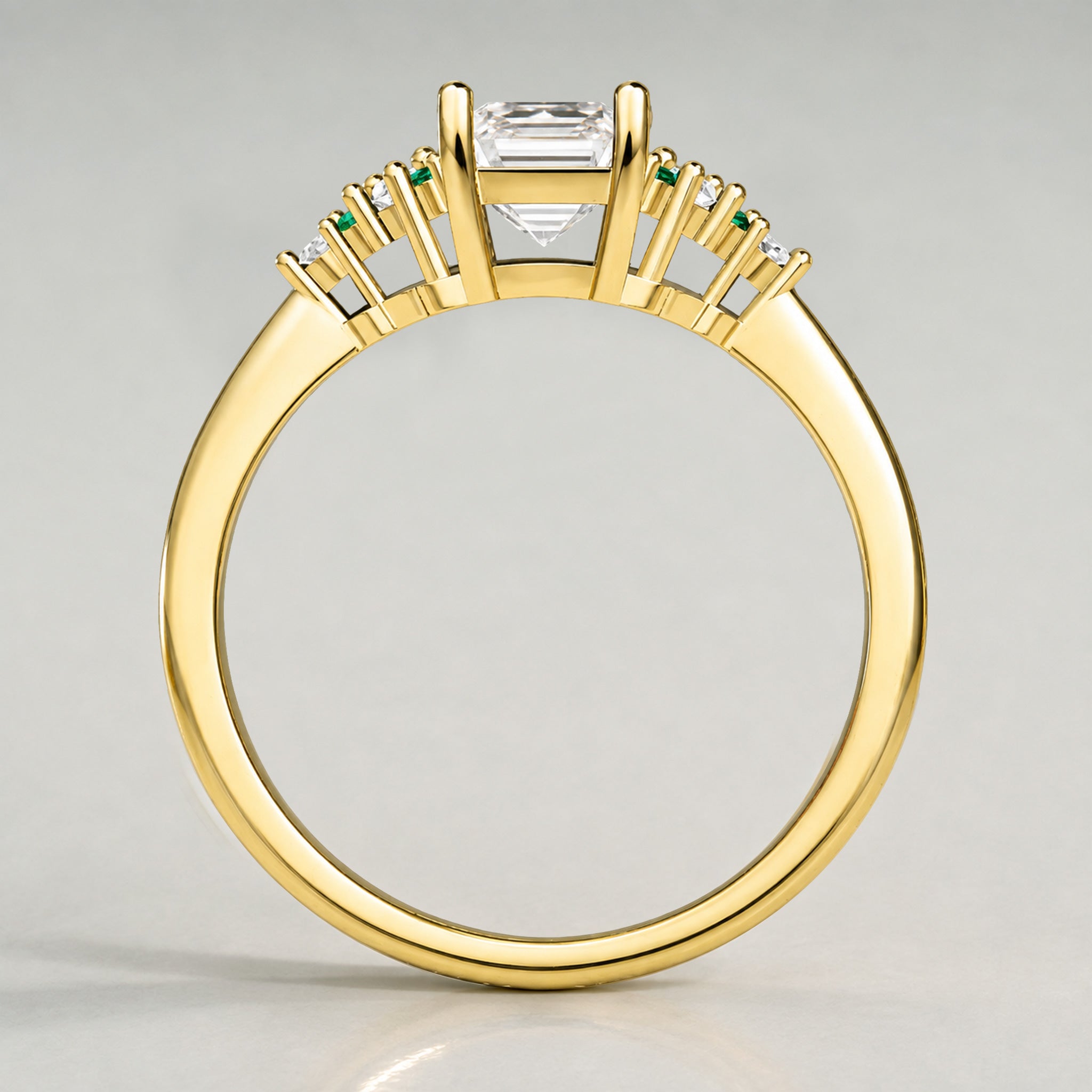Art Deco Design Emerald Cut Lab Grown Diamond Cathedral Basket Tapered Shank Polished Engagement Rings With Round Cut Accent Diamonds And Green Emerald Side Stones #MCERL0002