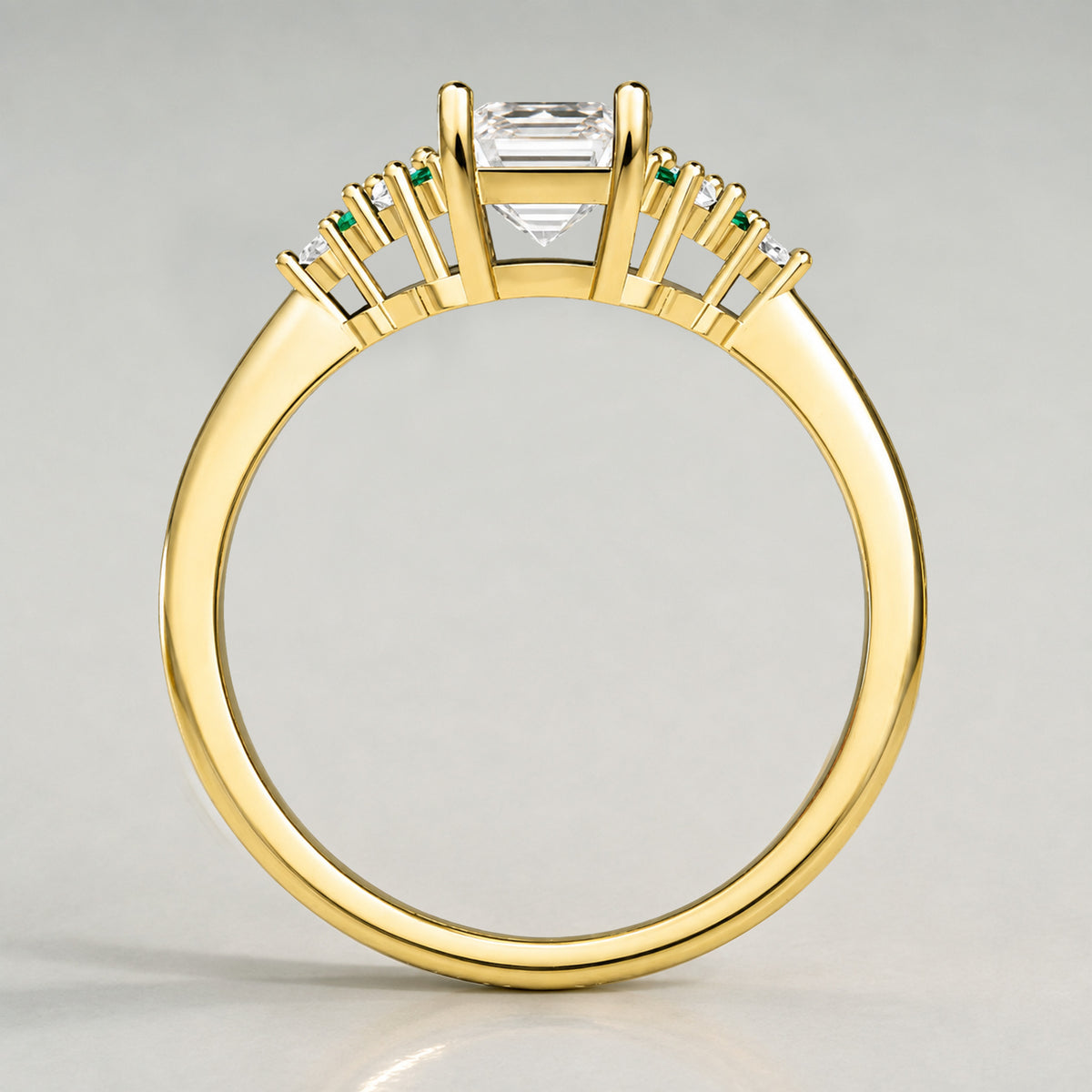 Art Deco Design Emerald Cut Lab Grown Diamond Cathedral Basket Tapered Shank Polished Engagement Rings With Round Cut Accent Diamonds And Green Emerald Side Stones #MCERL0002