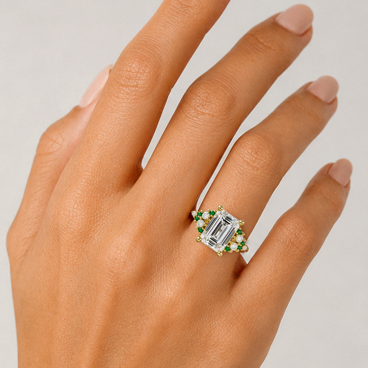 Art Deco Design Emerald Cut Lab Grown Diamond Cathedral Basket Tapered Shank Polished Engagement Rings With Round Cut Accent Diamonds And Green Emerald Side Stones #MCERL0002