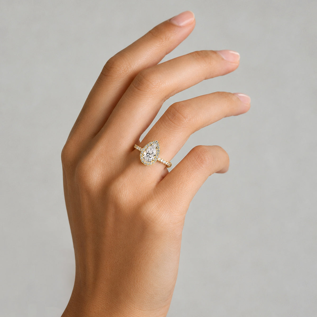 Classic Halo Design Pear Cut Lab Grown Diamond Cathedral Basket Pave Shank Engagement Ring With Round Cut Accent Stones #MCERL0060