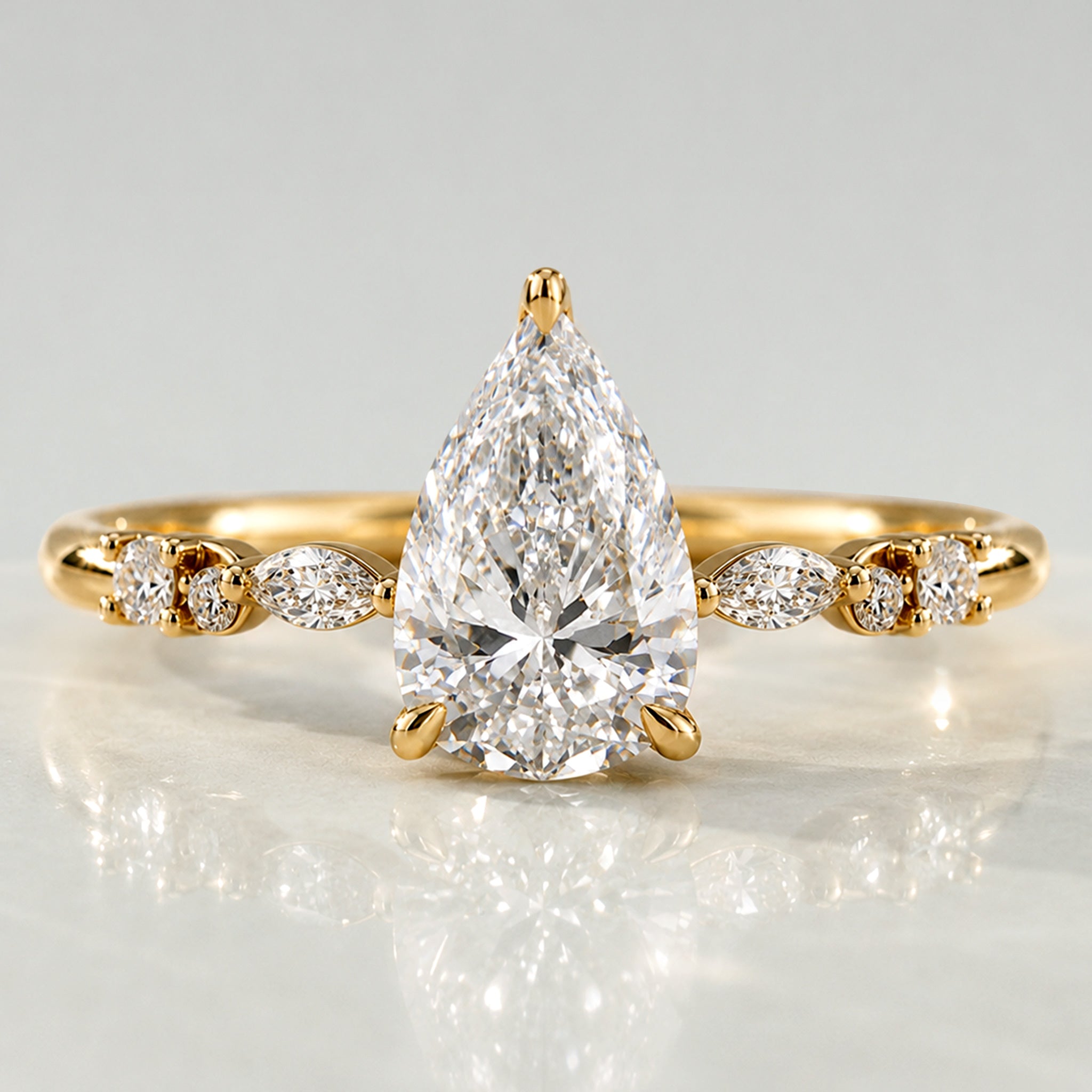Hidden Halo Design Pear Cut Lab Grown Diamond Center Stone Pave Shank Engagement Ring With Round Cut And Marquise Cut Accent Stones #MCERL0114