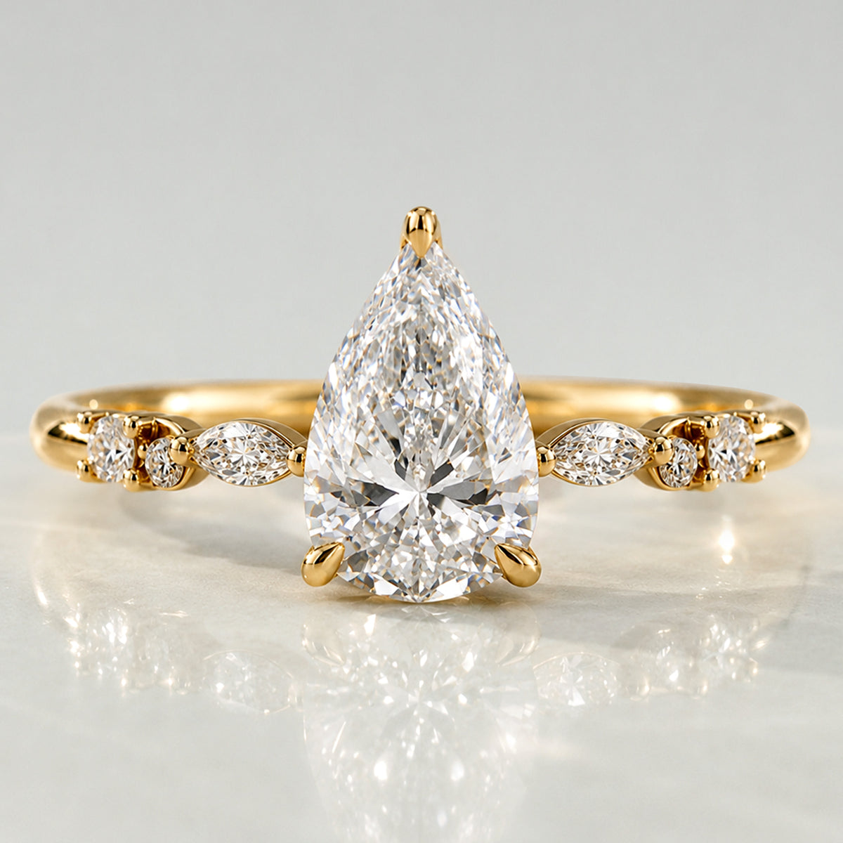 Hidden Halo Design Pear Cut Lab Grown Diamond Center Stone Pave Shank Engagement Ring With Round Cut And Marquise Cut Accent Stones #MCERL0114