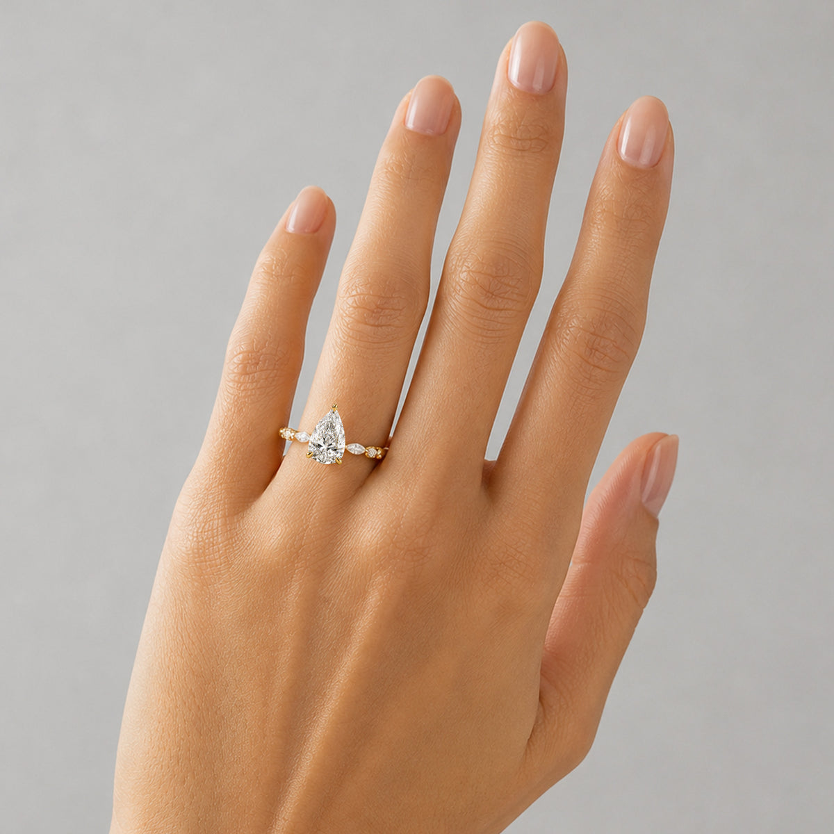 Hidden Halo Design Pear Cut Lab Grown Diamond Center Stone Pave Shank Engagement Ring With Round Cut And Marquise Cut Accent Stones #MCERL0114