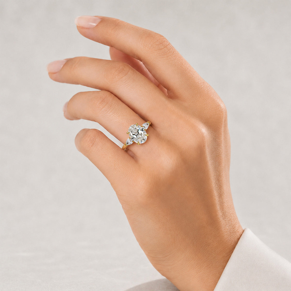 Three Stones Modern Design Oval Cut Lab Grown Diamond Tulip Basket Engagement Ring With Pear Cut Accent Stones #MCERL0140