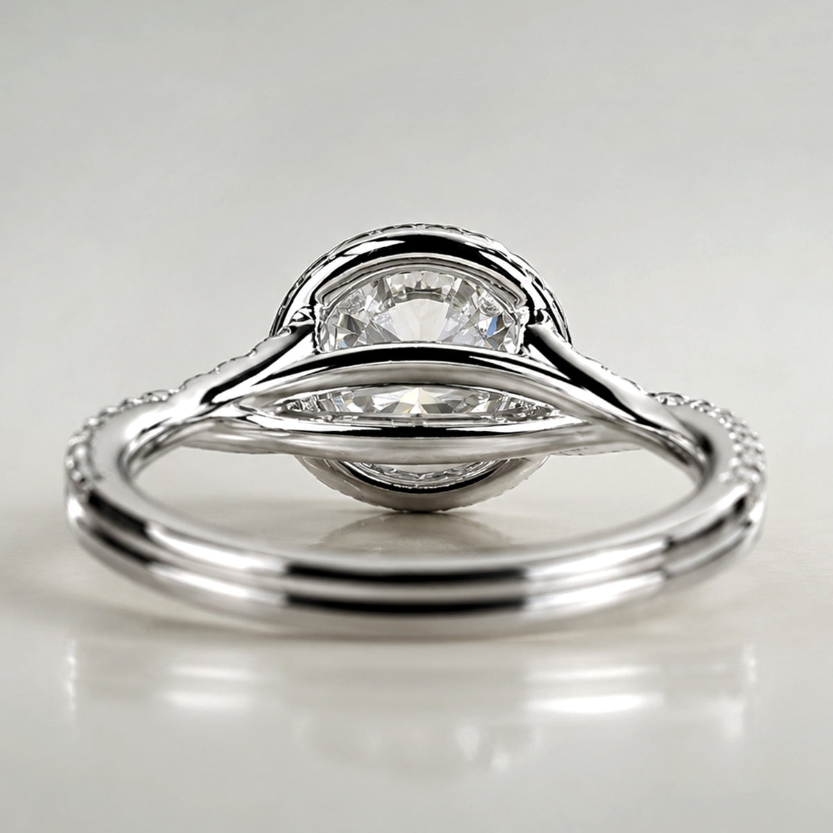 Modern Halo Design Round Cut Lab Grown Diamond Center Stone Twisted Pave Shank Engagement Ring With Round Cut Accent Stones #MCERL0197
