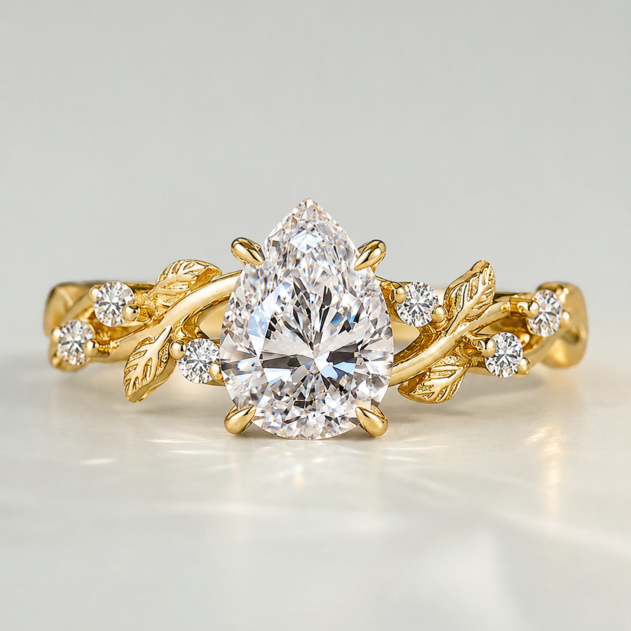 Nature Inspired Design Pear Cut Lab Grown Diamond Center Stone Engagement Ring With Round Cut Accent Stones #MCERL0220