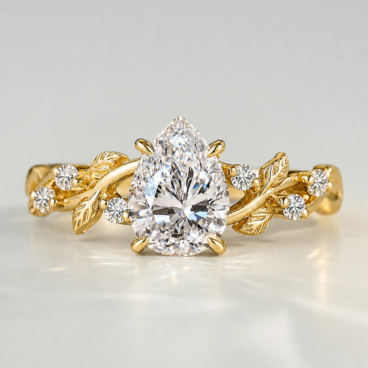 Nature Inspired Design Pear Cut Lab Grown Diamond Center Stone Engagement Ring With Round Cut Accent Stones #MCERL0220