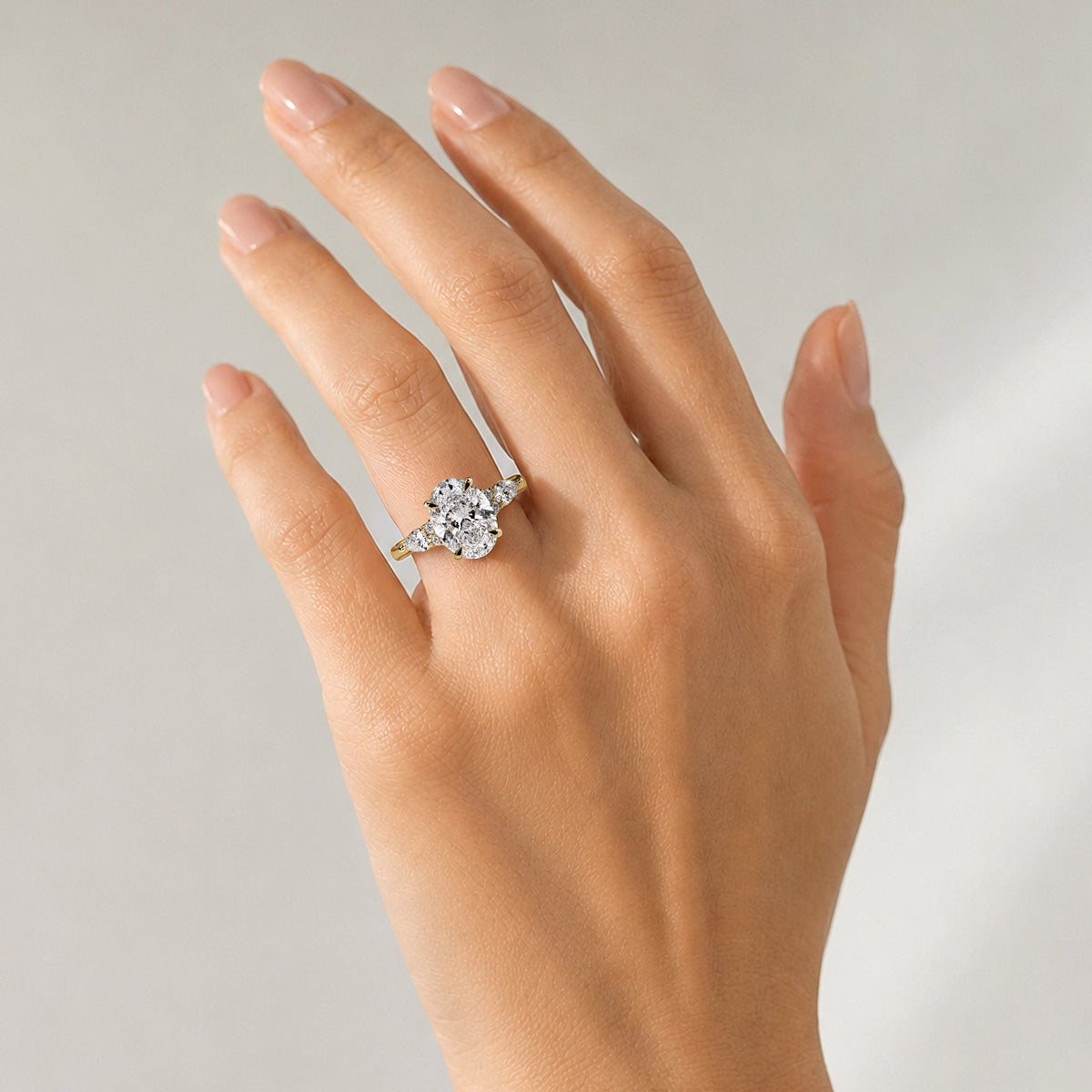 Modern Design Oval Cut Lab Grown Diamond Tulip Basket Engagement Ring With Round Cut And Pear Cut Accent Stones #MCERL0266